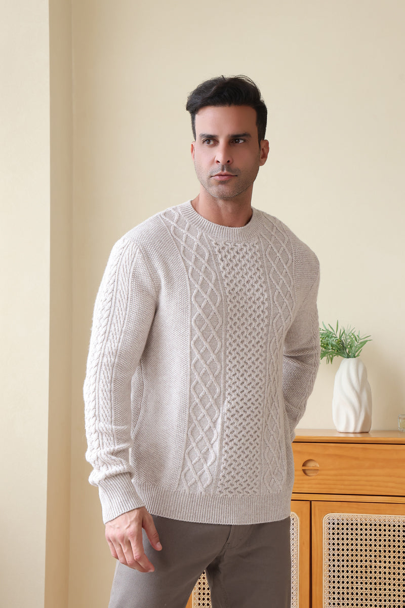 Man wearing a luxury aran cashmere cable knit sweater by Inis Aran Ireland#color_seoul-beige