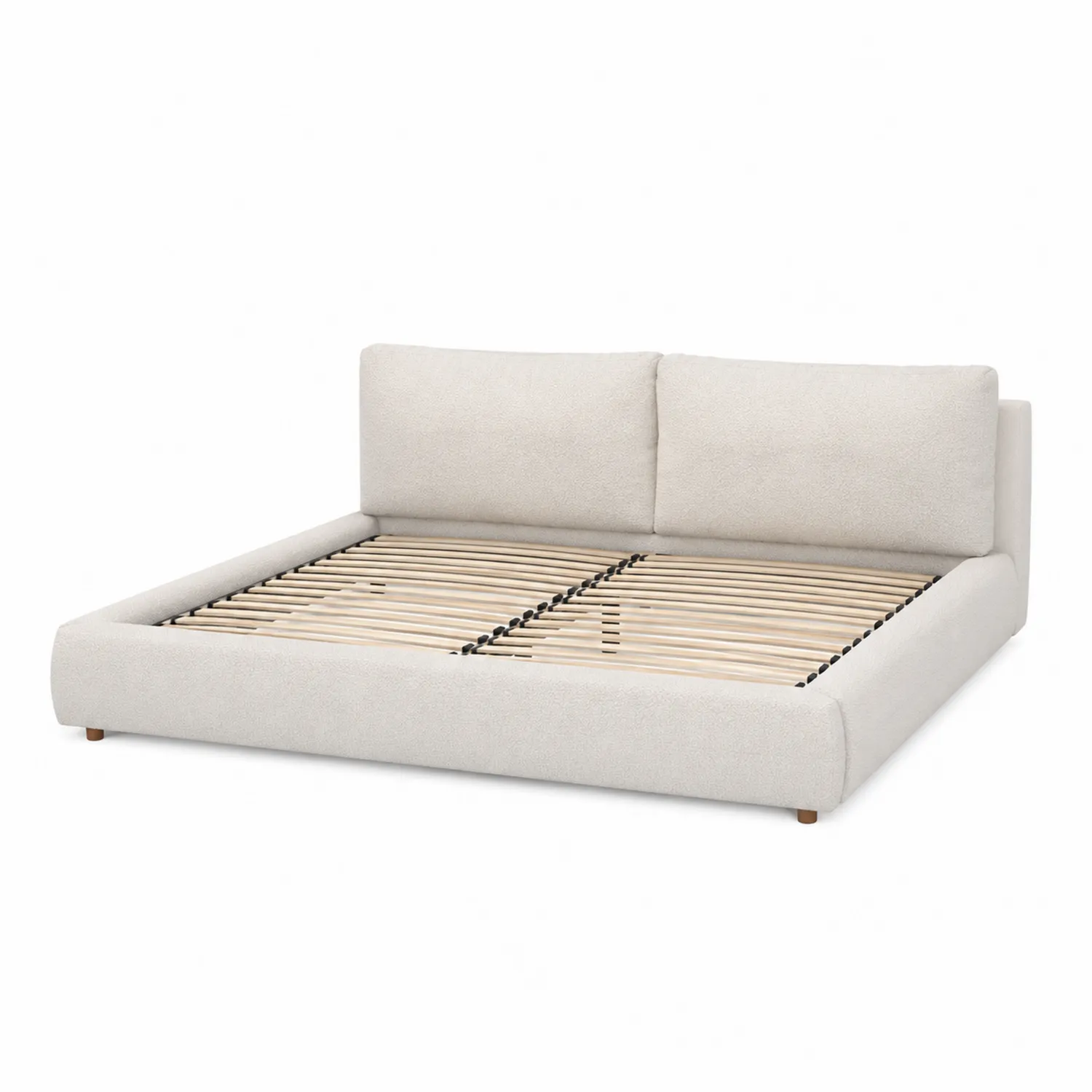 Cama de matrimonio tapizada en beige con cabecera acolchada