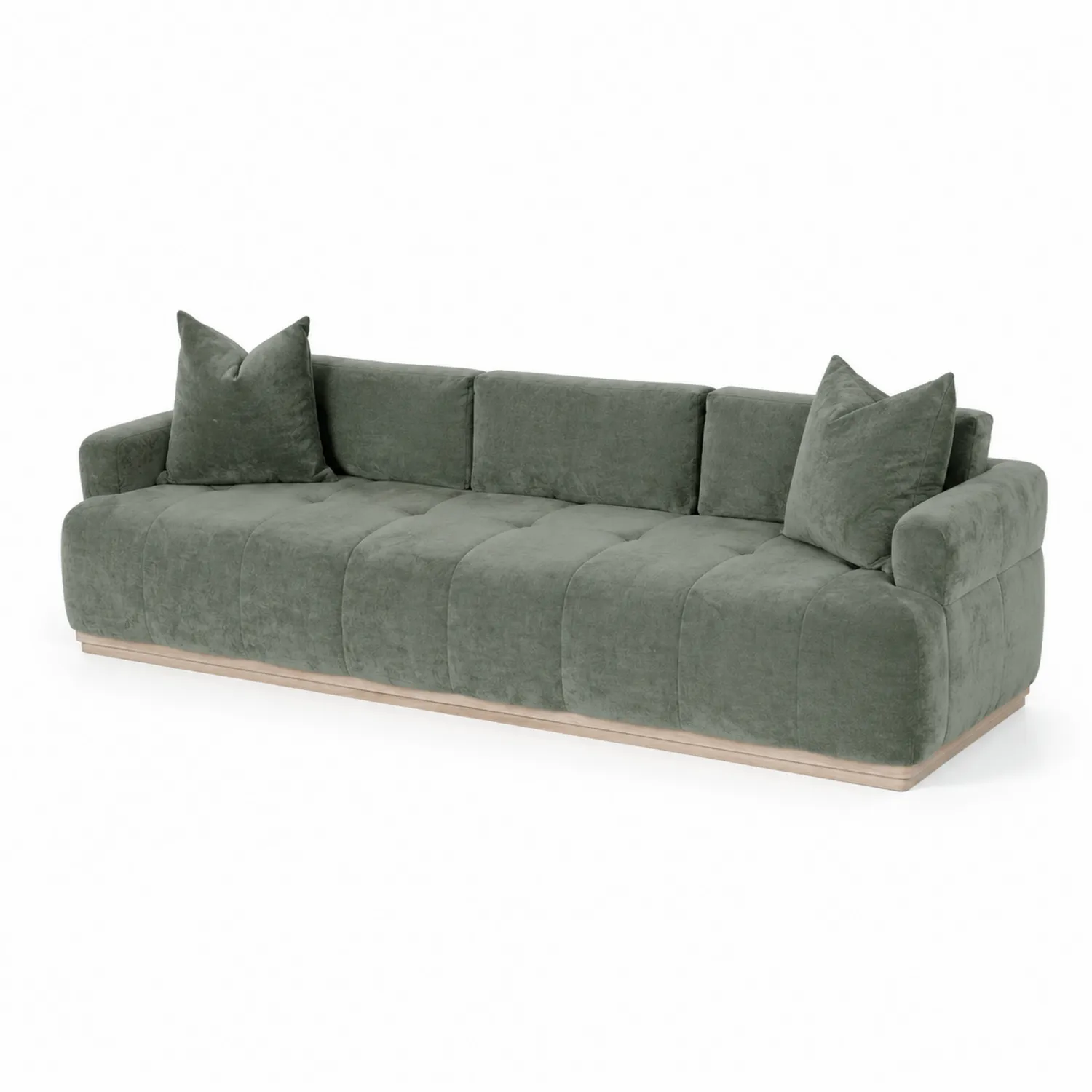 Canapé en velours vert avec coussins