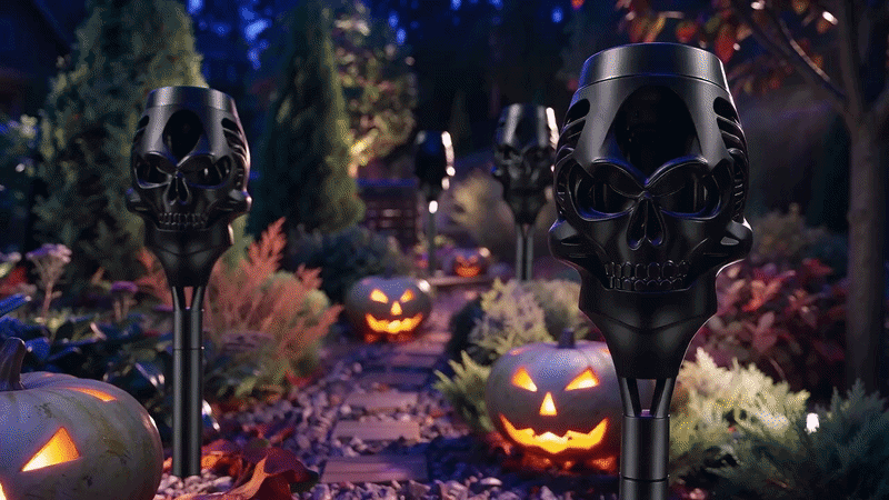 Suggested image: several skull flame lights arranged in a row along a dark Halloween pathway