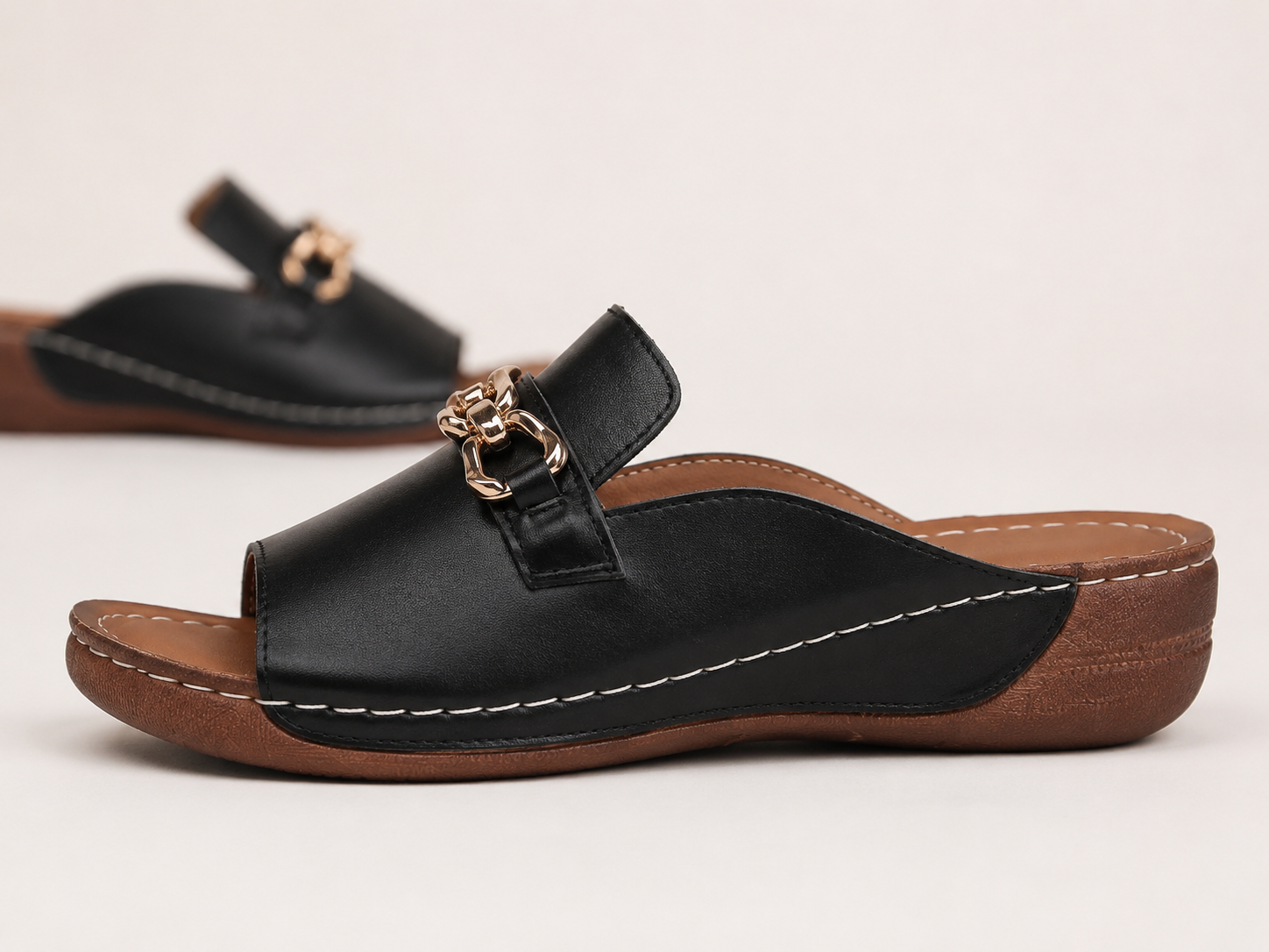 Suggested image: side view of the wedge sole showing heel height, stable base, and smooth walking angle