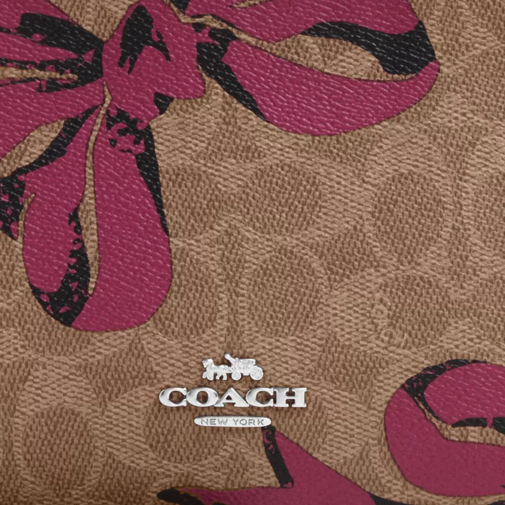 Slim Crossbody Bag In Signature Canvas With Bow Print