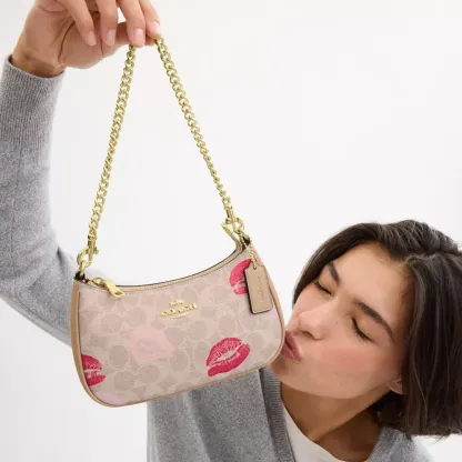 Teri Mini Crossbody Bag In Signature Canvas With Lips Print