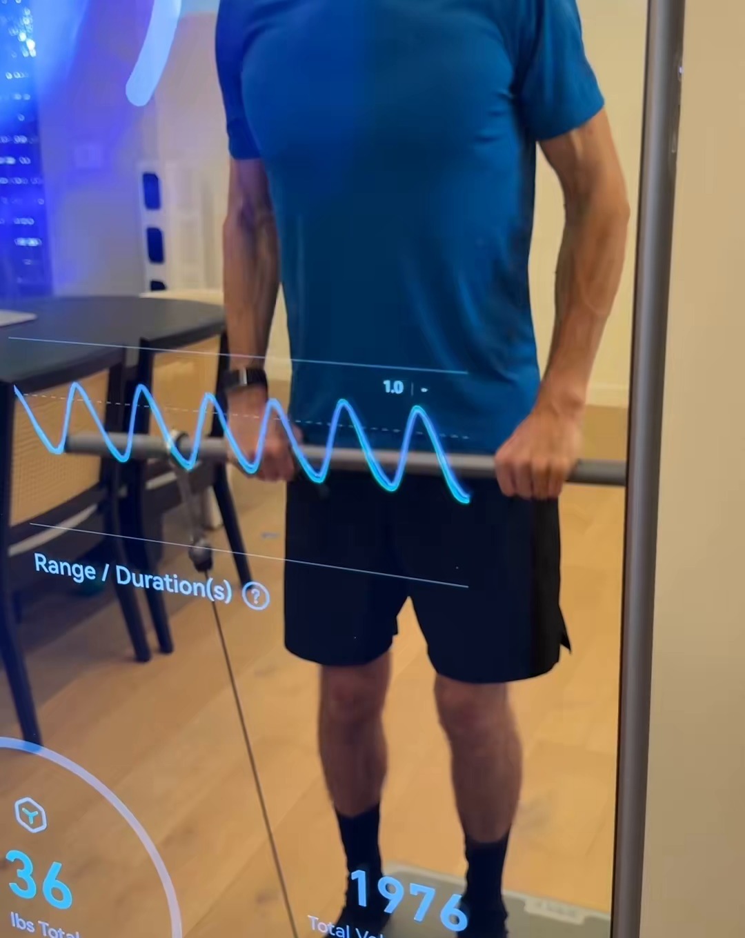 Person following a guided workout on fitness mirror