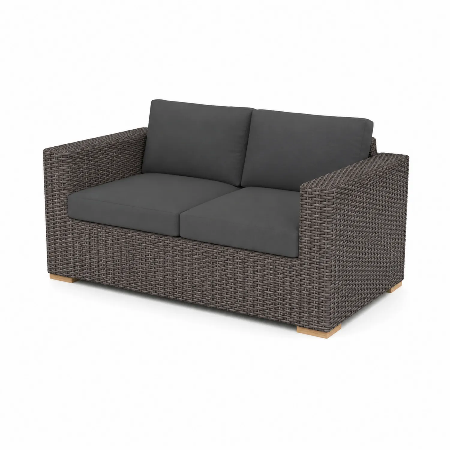 Divano in rattan con cuscini grigi