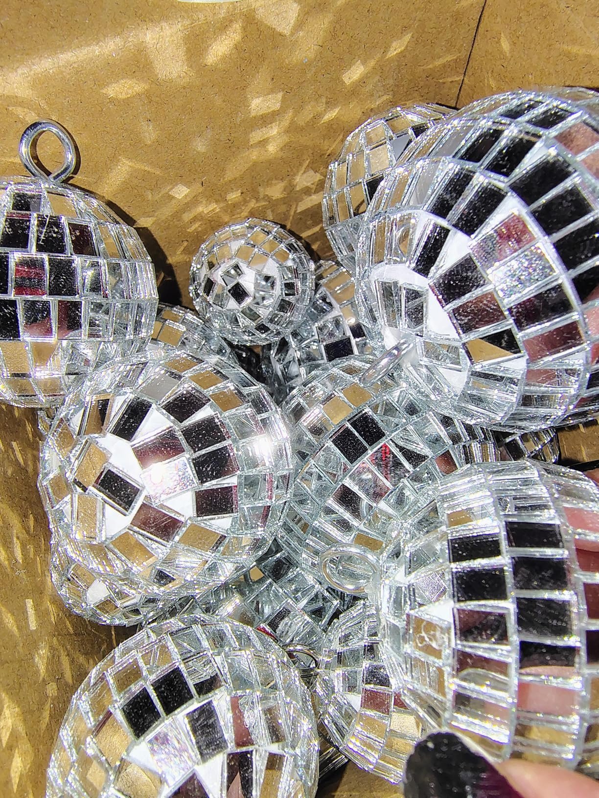 We're going to order the little discs with all loophole in them to hang them from the ceiling.