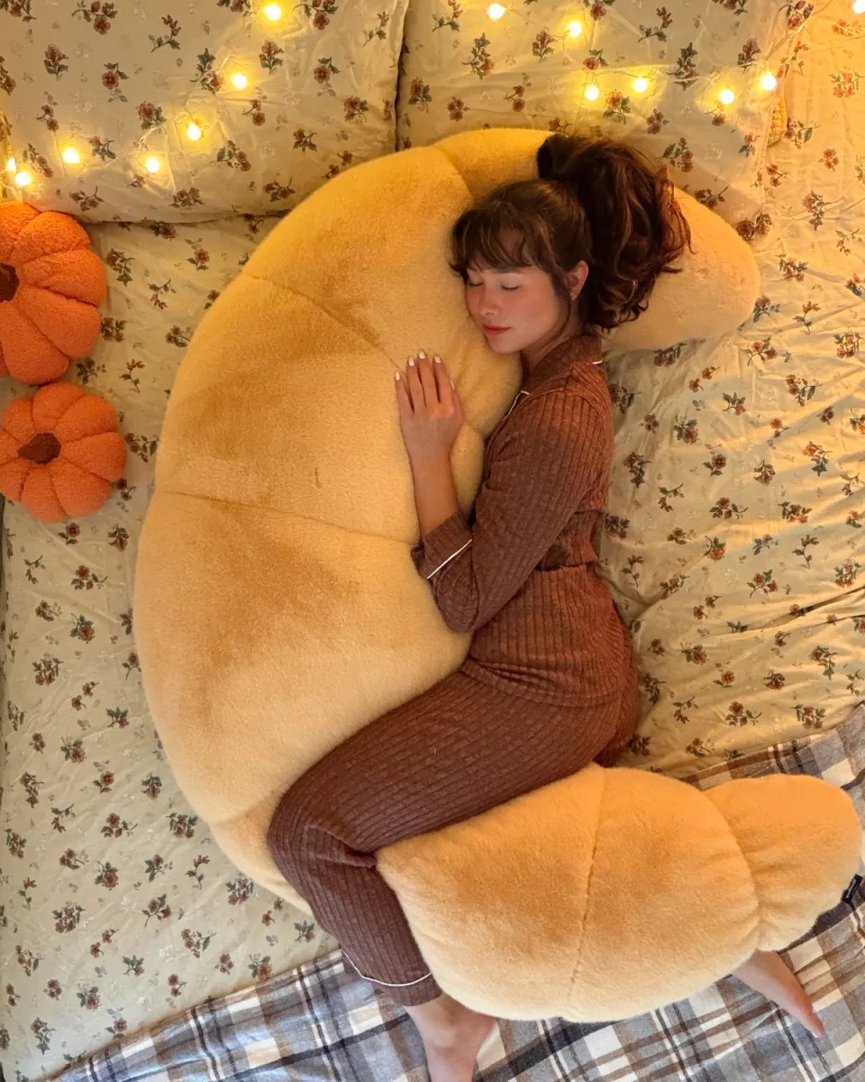 The ultimate 12-lb cuddle buddy designed for side sleepers and made to be held through it all.