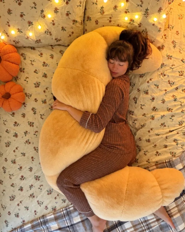 The ultimate 12-lb cuddle buddy designed for side sleepers and made to be held through it all.