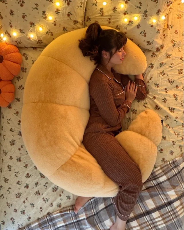 The ultimate 12-lb cuddle buddy designed for side sleepers and made to be held through it all.