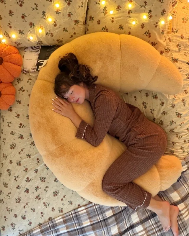 The ultimate 12-lb cuddle buddy designed for side sleepers and made to be held through it all.