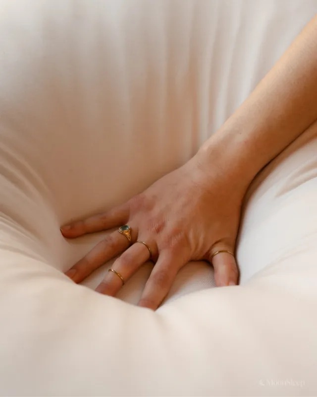 The ultimate 12-lb cuddle buddy designed for side sleepers and made to be held through it all.
