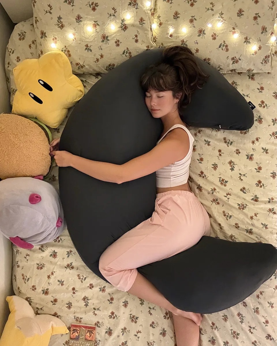 The ultimate 12-lb cuddle buddy designed for side sleepers and made to be held through it all.