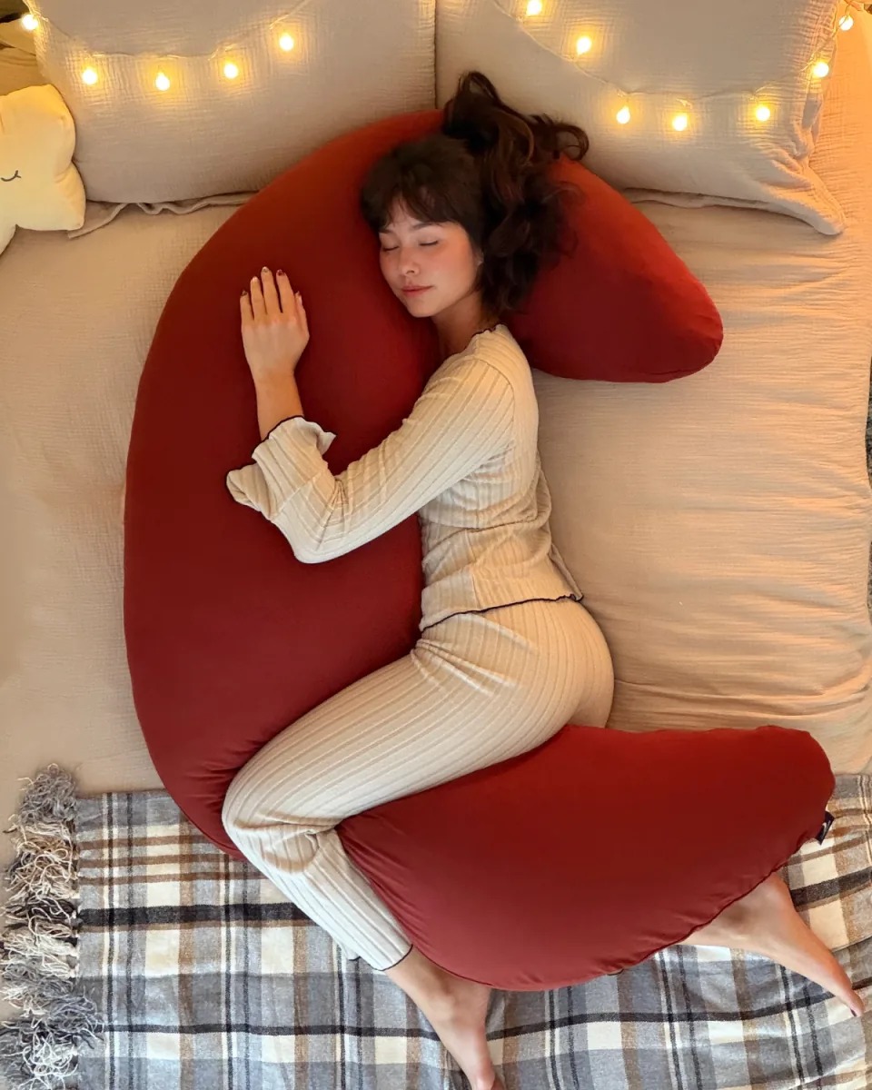The ultimate 12-lb cuddle buddy designed for side sleepers and made to be held through it all.