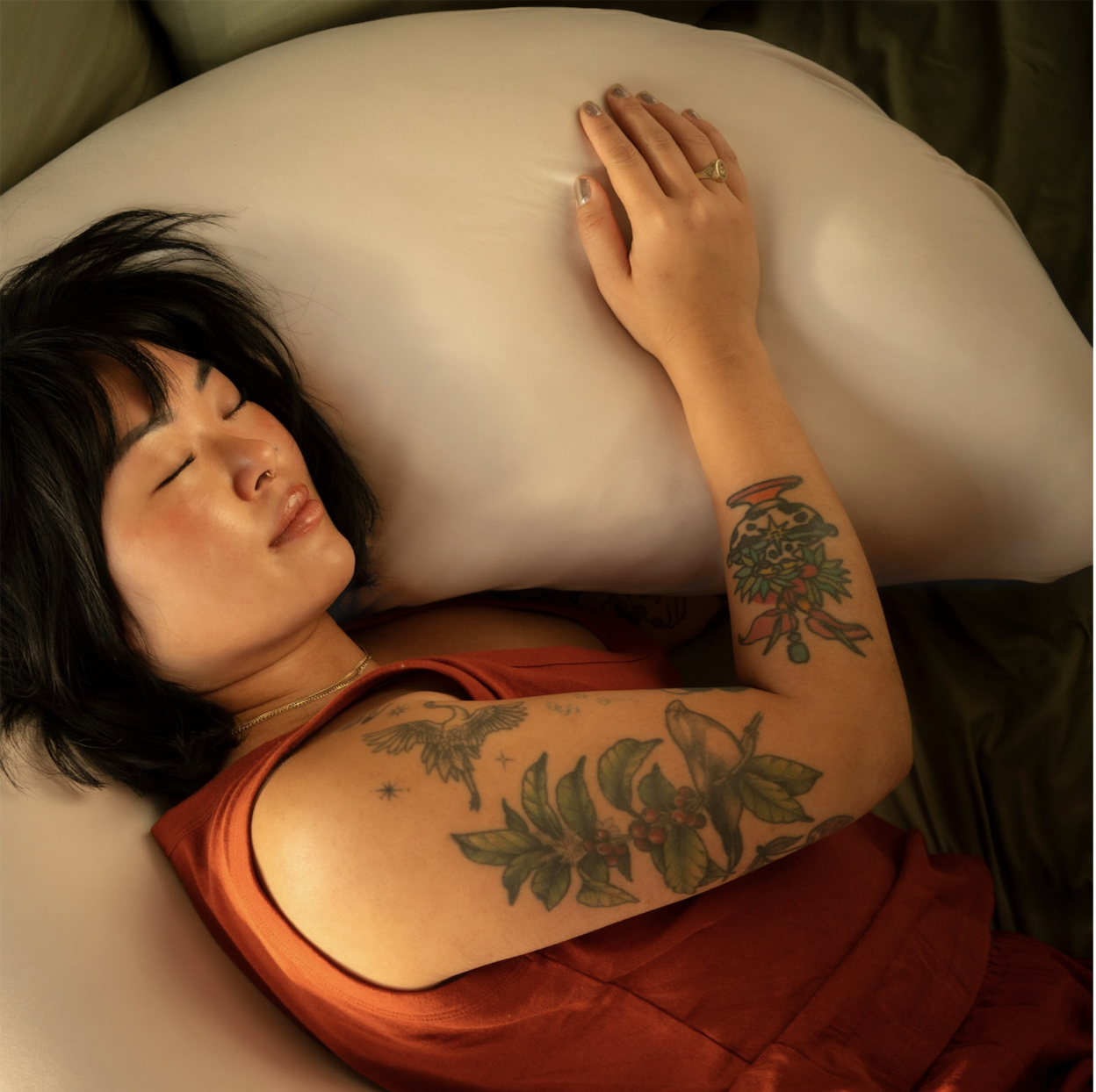 The ultimate 12-lb cuddle buddy designed for side sleepers and made to be held through it all.