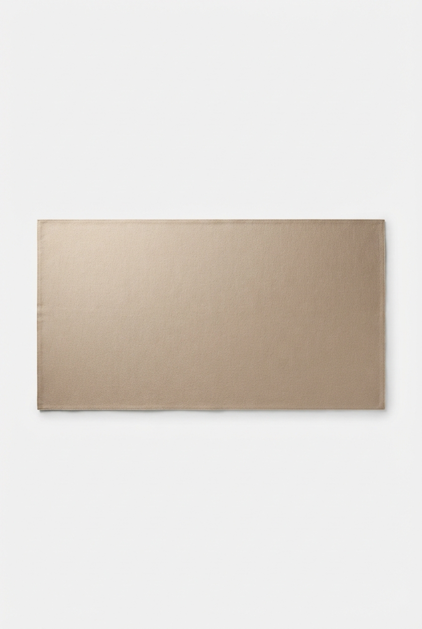 Minimalist beige cotton-linen shawl folded on an off-white studio background