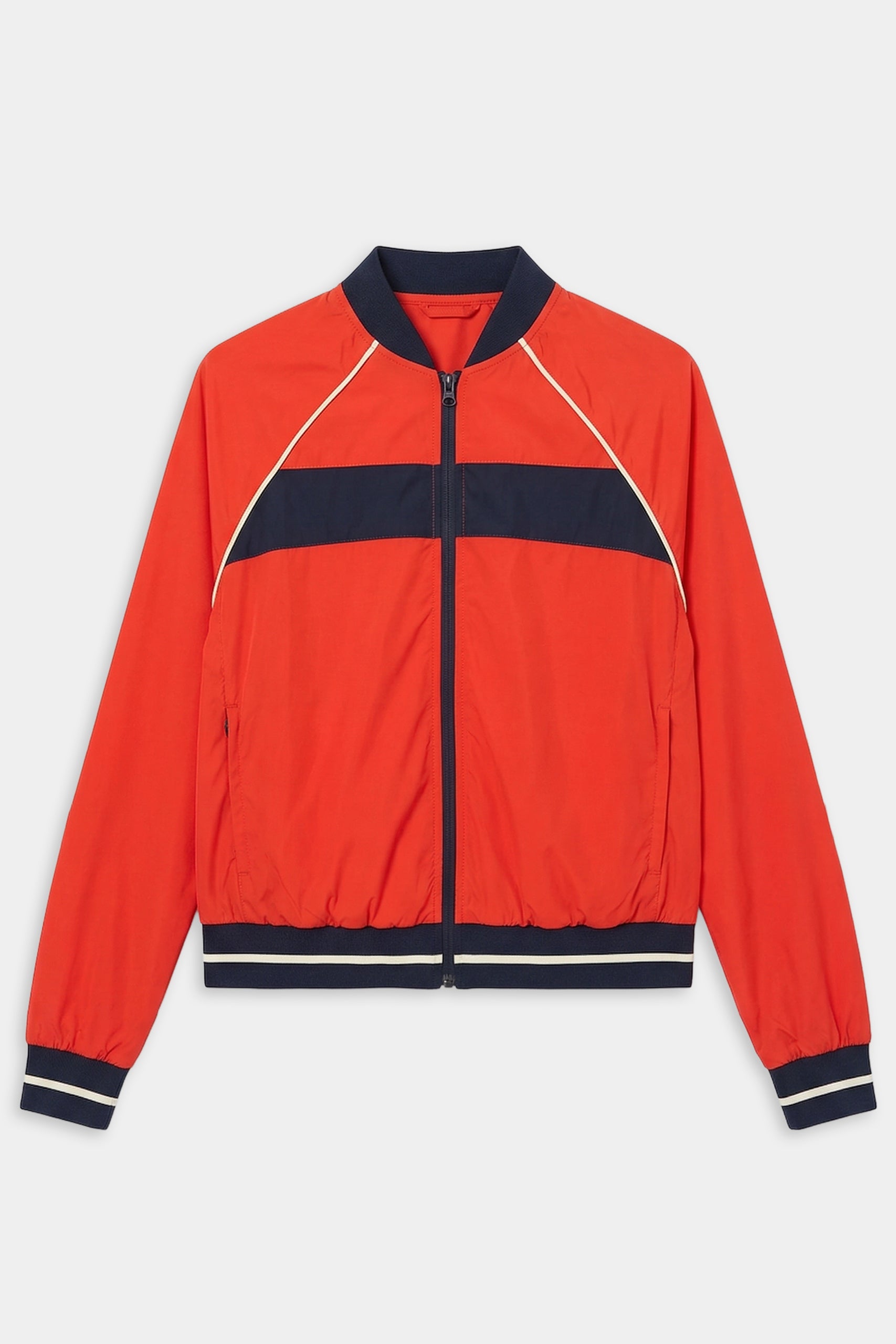 The SPLITS59 Carrie Woven Nylon Jacket in Lotus Red/Indigo features navy and white stripes, ribbed cuffs and waistband, two front pockets, and a comfy nylon-spandex blend, shown against a white background.
