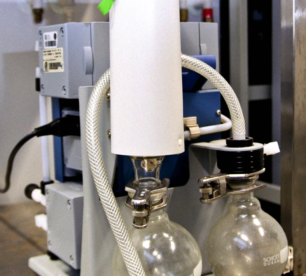 Small oil-sealed vacuum pump used to create deep vacuum