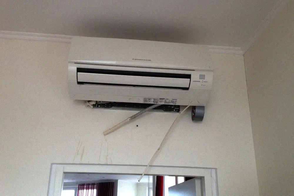 Exposed indoor air conditioner evaporator assembly during service