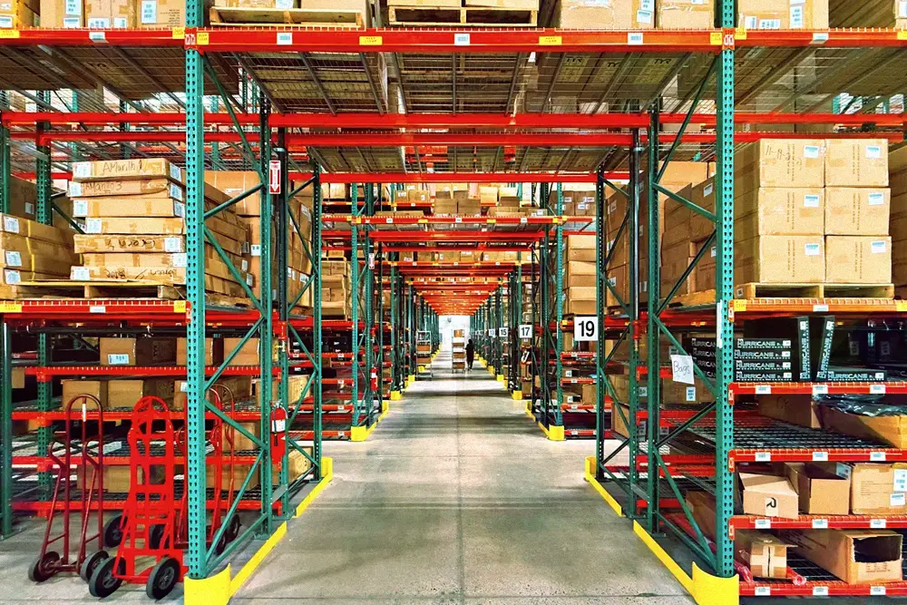 Long rows of inventory shelves inside a California warehouse