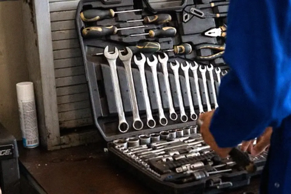 Mechanic organizing a professional toolset before service work