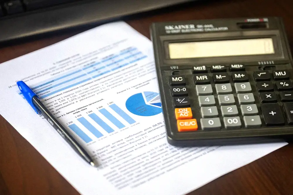 Calculator and cost worksheet used to compare refrigerant prices and delivered cost.