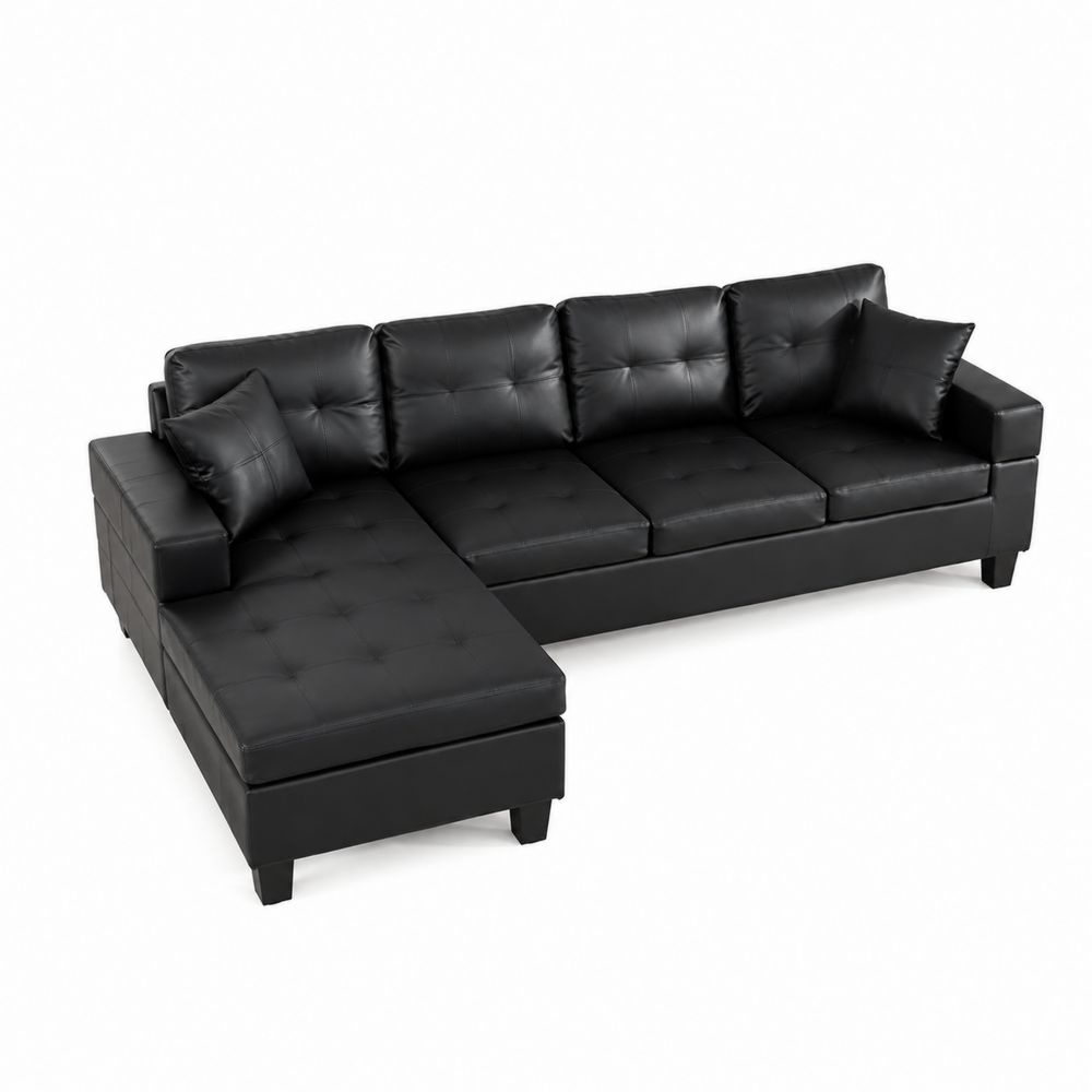 Czarna narożna sofa z ekoskóry z poduszkami