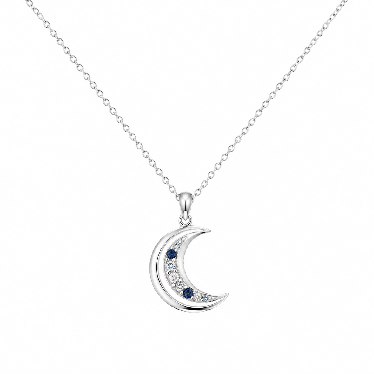 Silberne Halskette mit mondförmigem Anhänger und blauen Kristallen-ecolivio