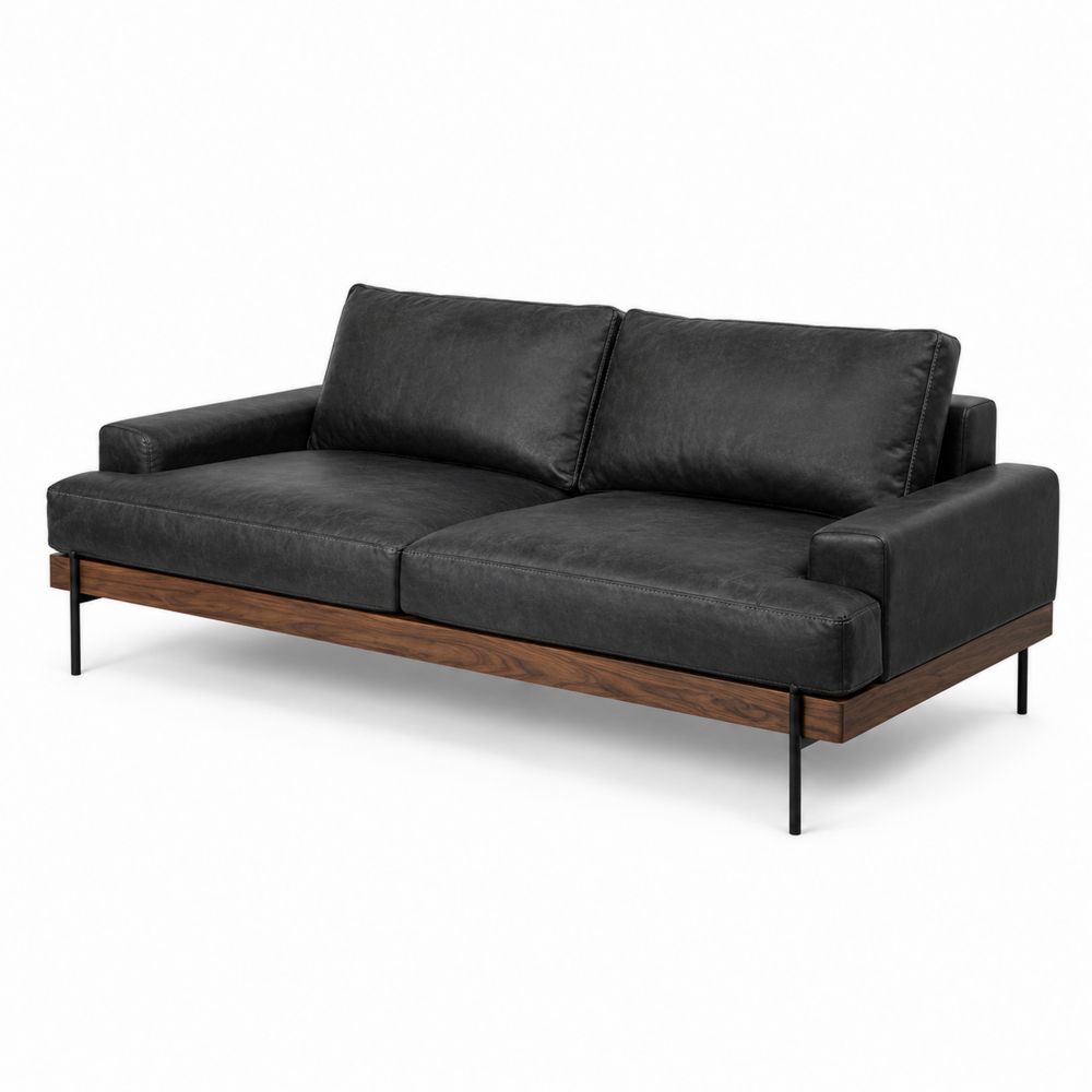 Divano in similpelle nero con struttura in legno e metallo