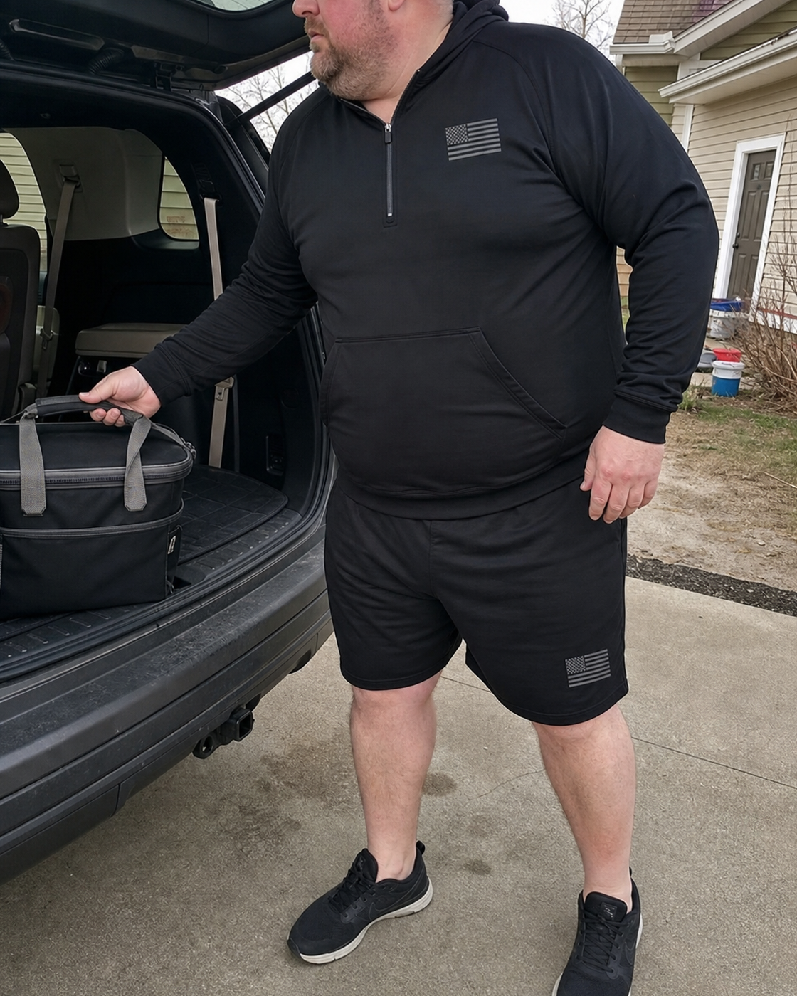 AI style inspiration wearing Black quarter-zip hoodie and matching shorts during a weekend driveway moment