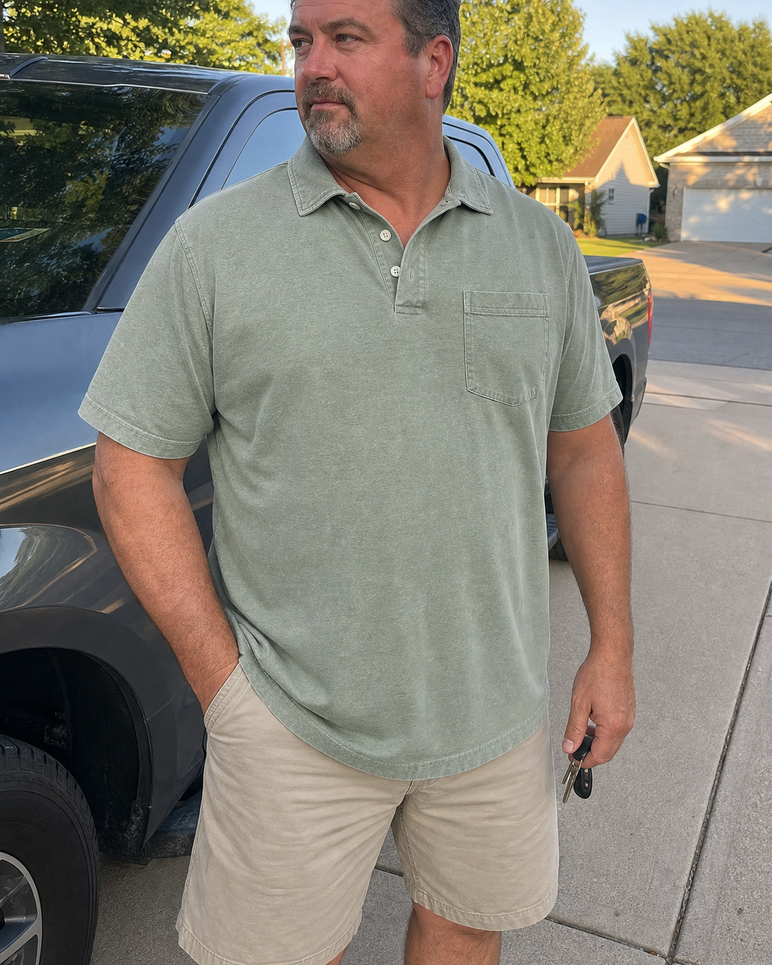 AI style inspiration wearing a Washed Sage Green pocket polo in a suburban driveway