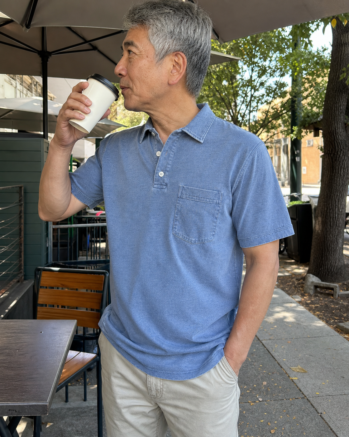 AI style inspiration wearing a Washed Steel Blue pocket polo at a neighborhood cafe