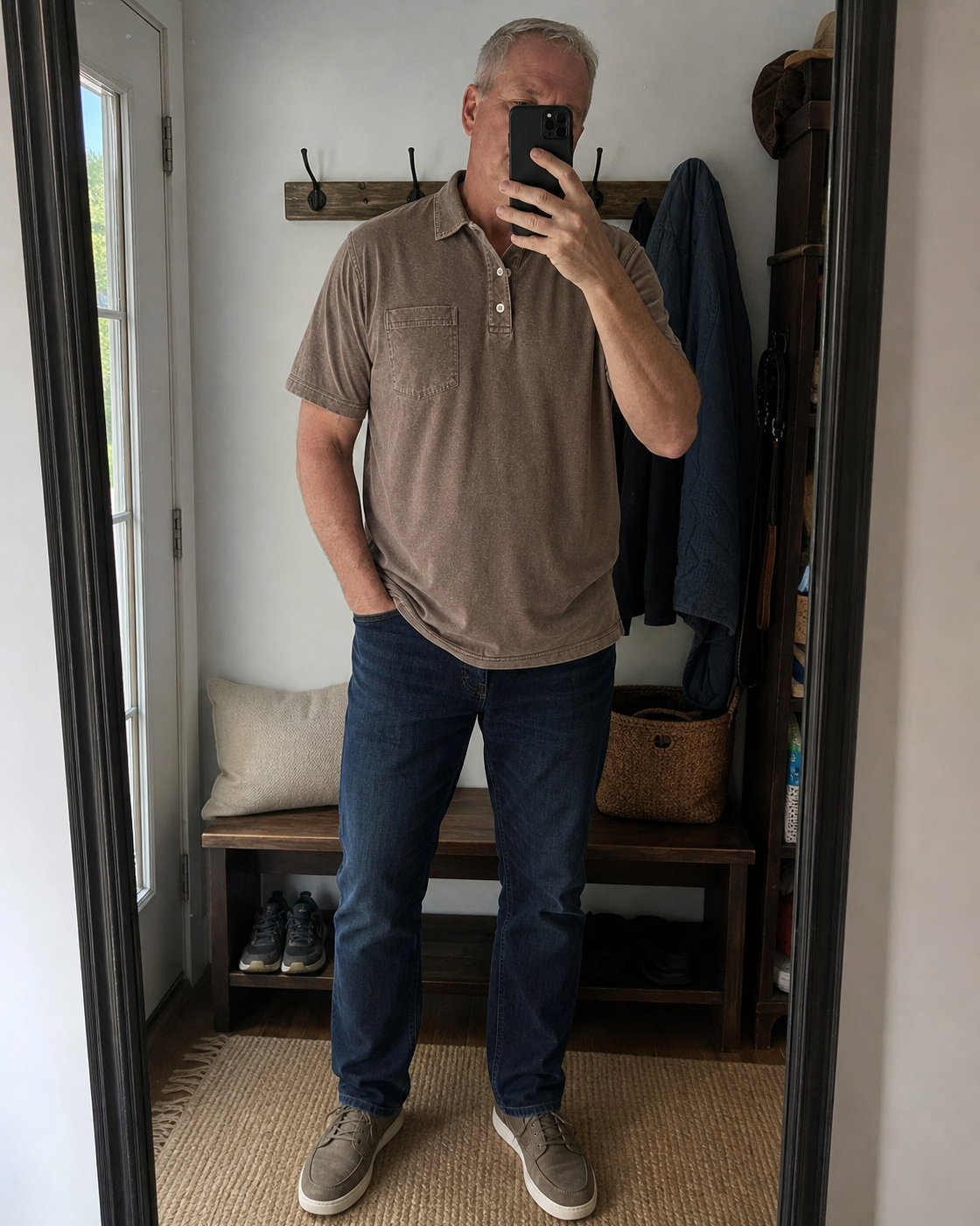AI style inspiration mirror fit wearing a Washed Cocoa Brown pocket polo in an entryway