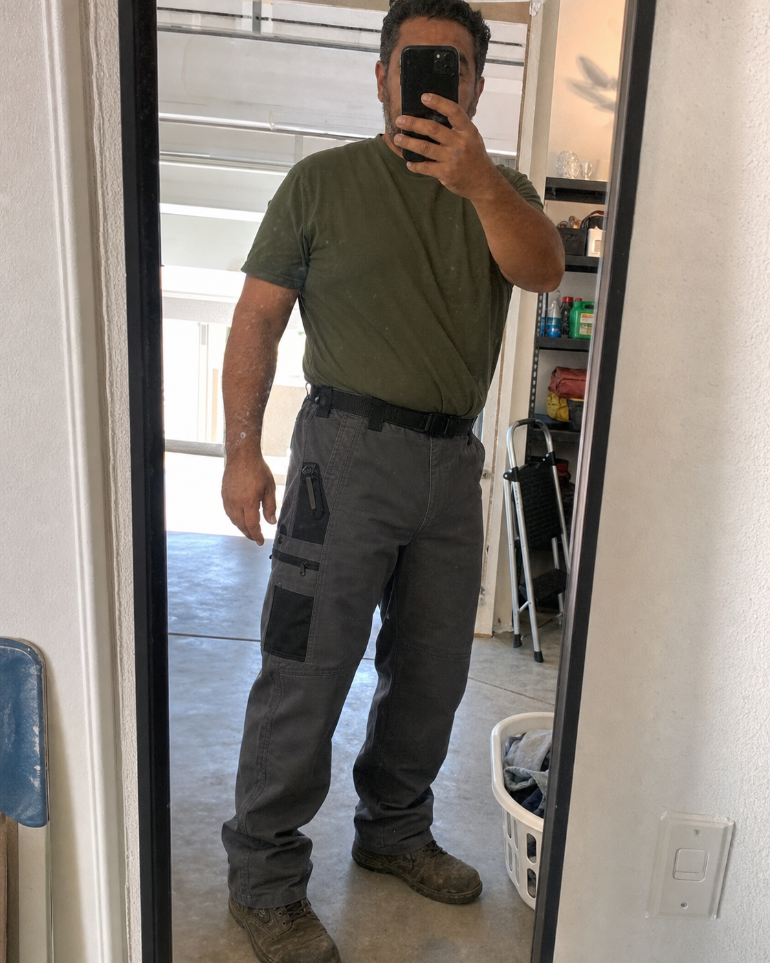 AI style inspiration mirror fit wearing Charcoal tactical work pants in a garage