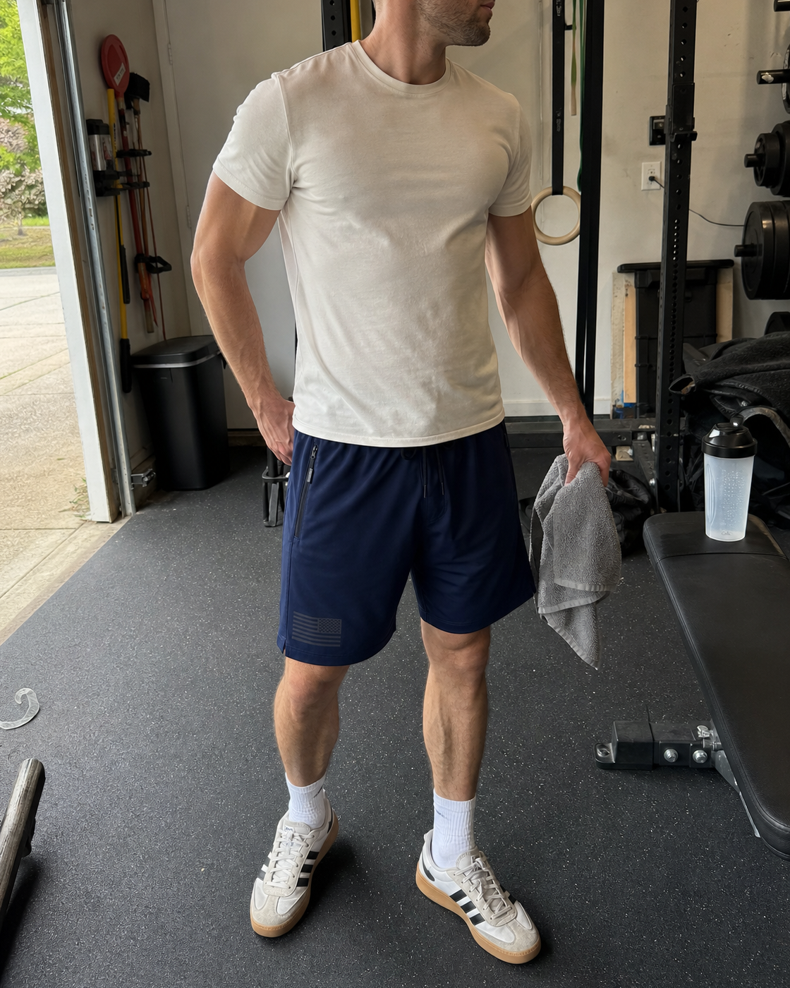 AI style inspiration wearing Navy tactical athletic shorts in a garage gym