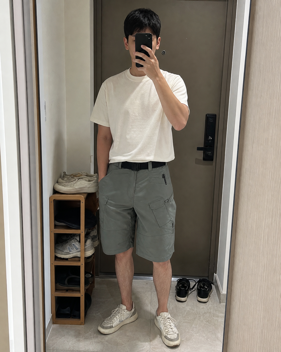 AI style inspiration mirror fit wearing Green tactical cargo shorts