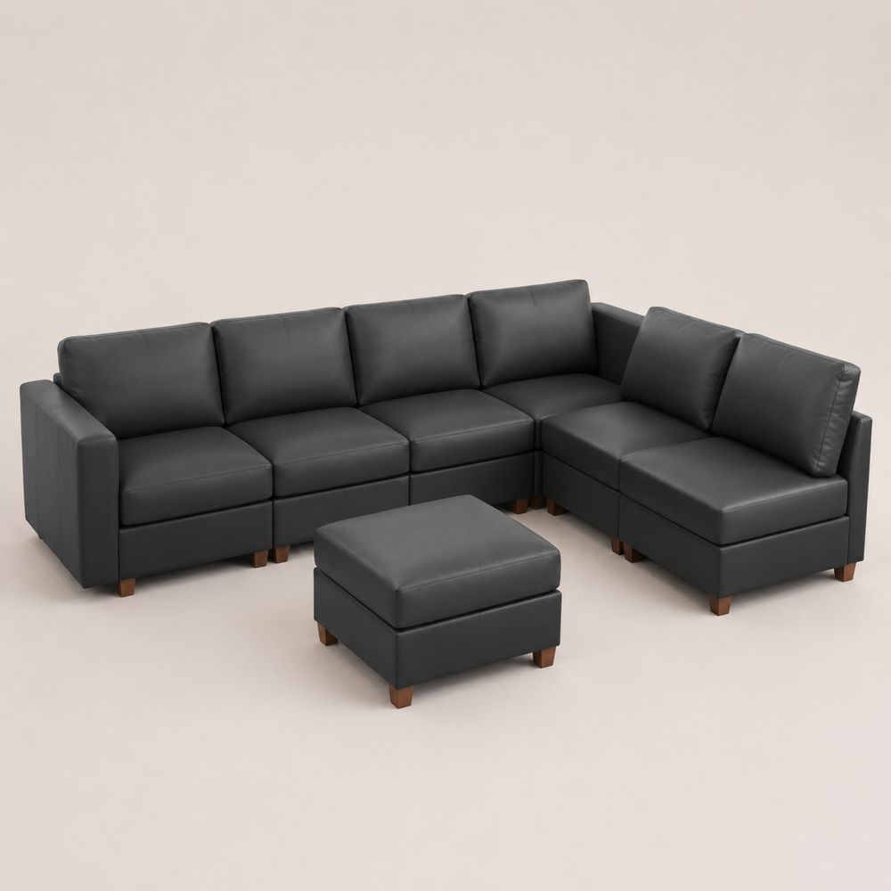 Divano modulare a forma di L in pelle sintetica nera con pouf