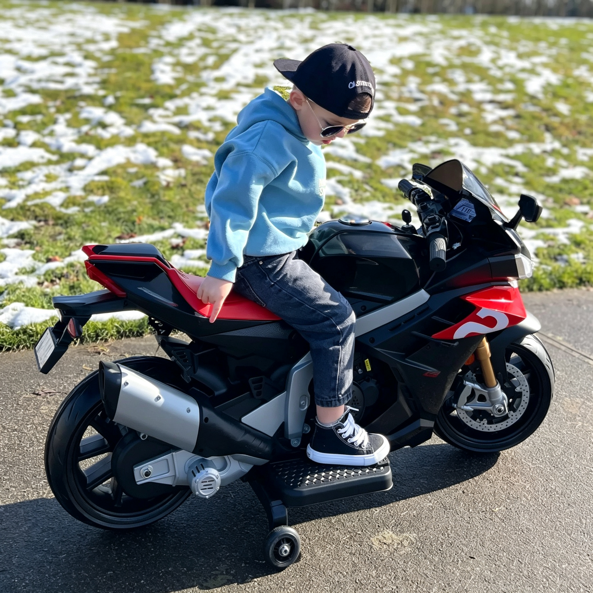 Red-black sport kids ride-on motorcycle looking great on paved roads and grassy areas encouraging outdoor adventures
