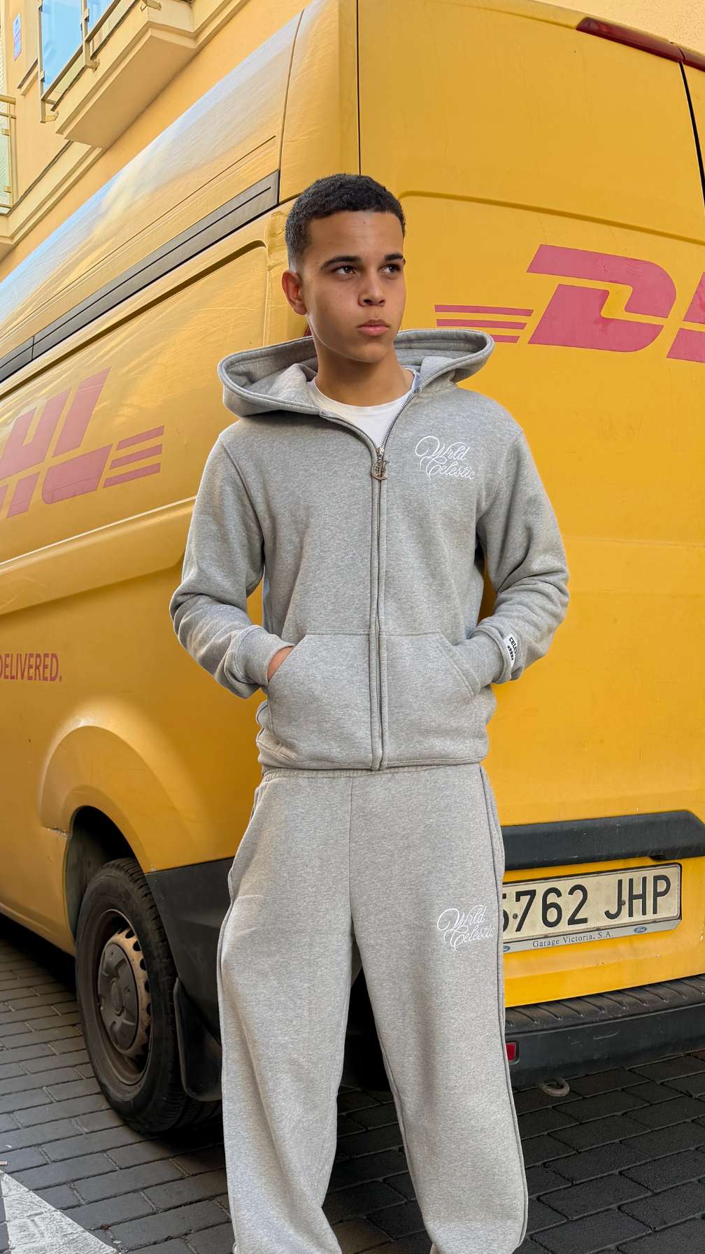 Unisex relaxed oversized fit of the Grey Basic Hoodie