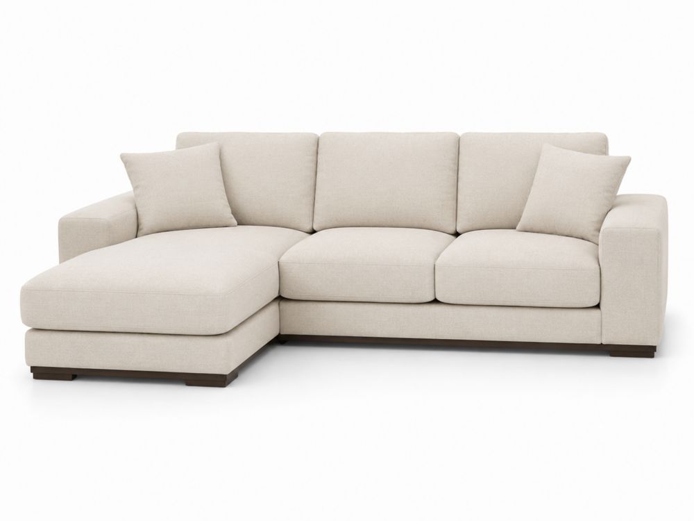 Sofá en L de tela beige con chaise longue