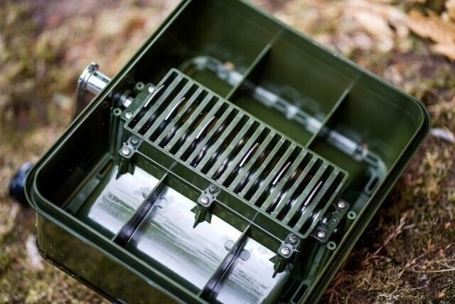 Bait prep gear sitting on the ground at a fishing bank