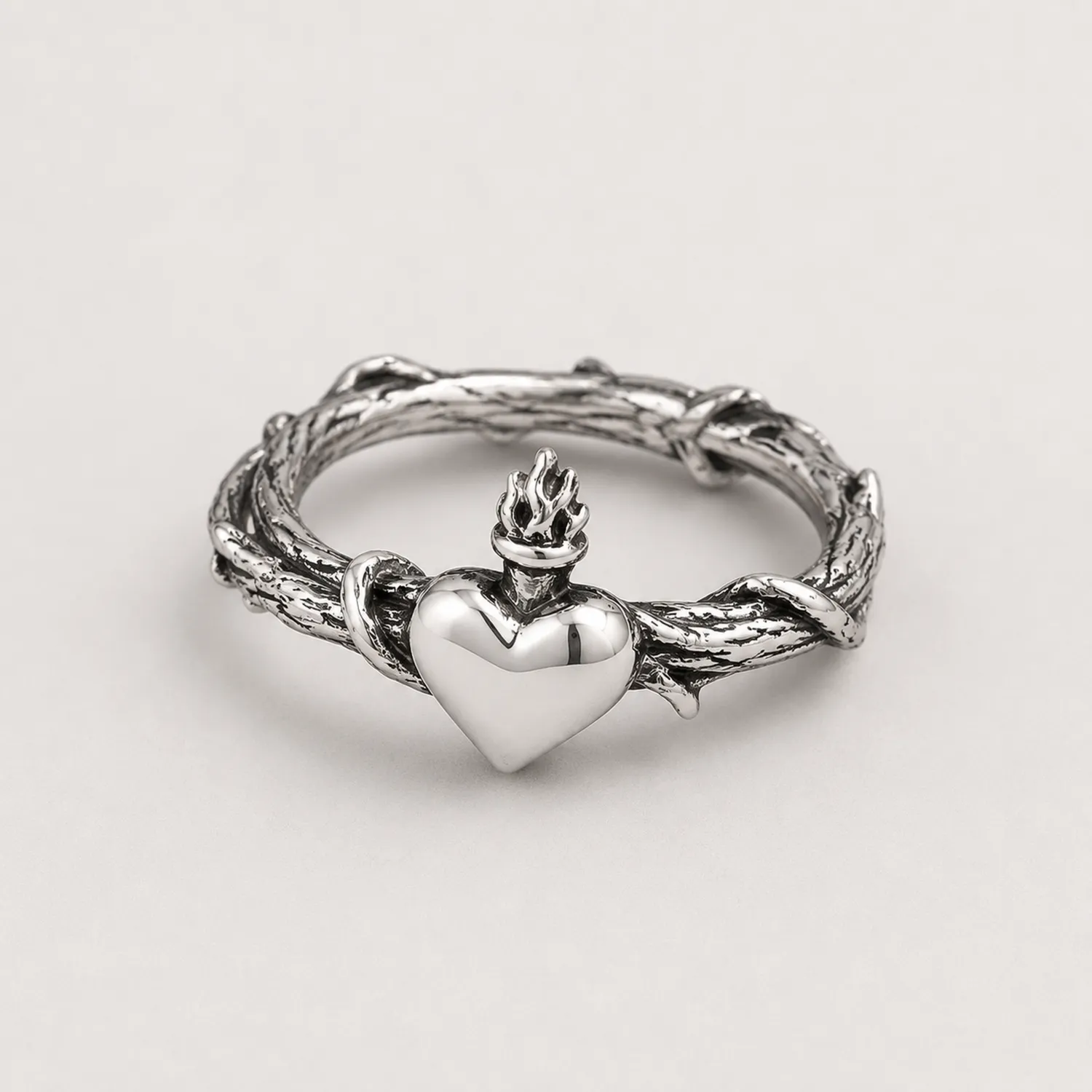 Anello Cuore Sacro Intrecciato Argento