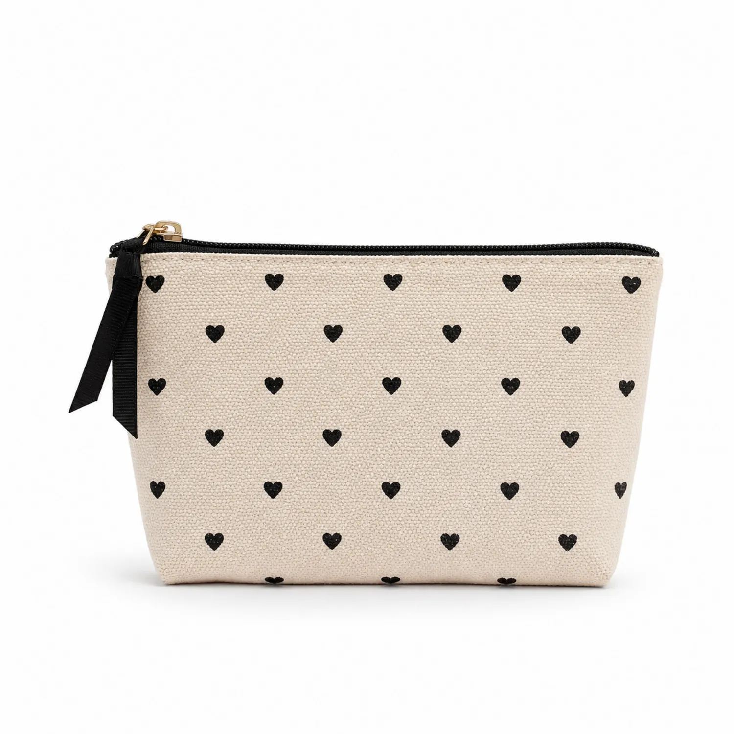Trousse de maquillage beige à motifs cœurs noirs