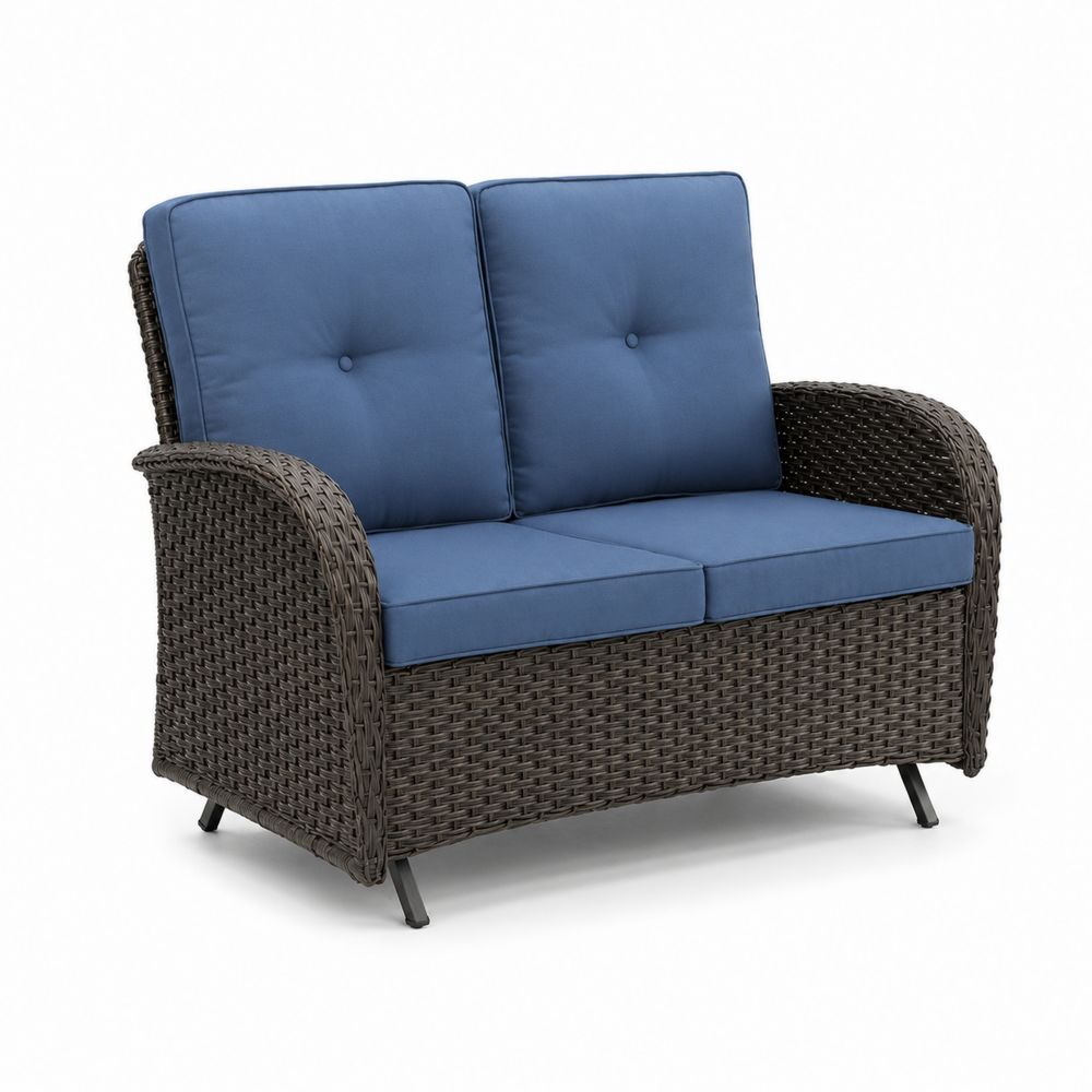 Sofá de mimbre sintético con cojines azules