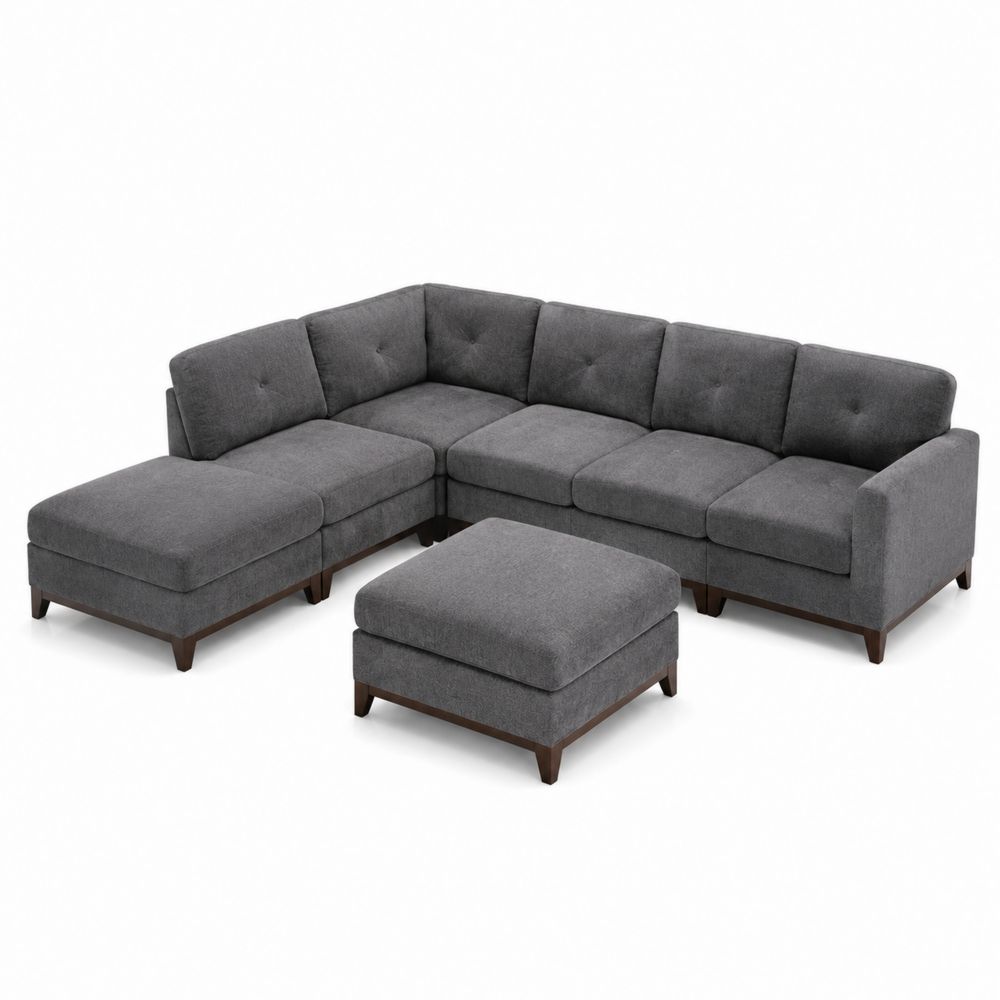 Sofá modular de tela gris con otomana