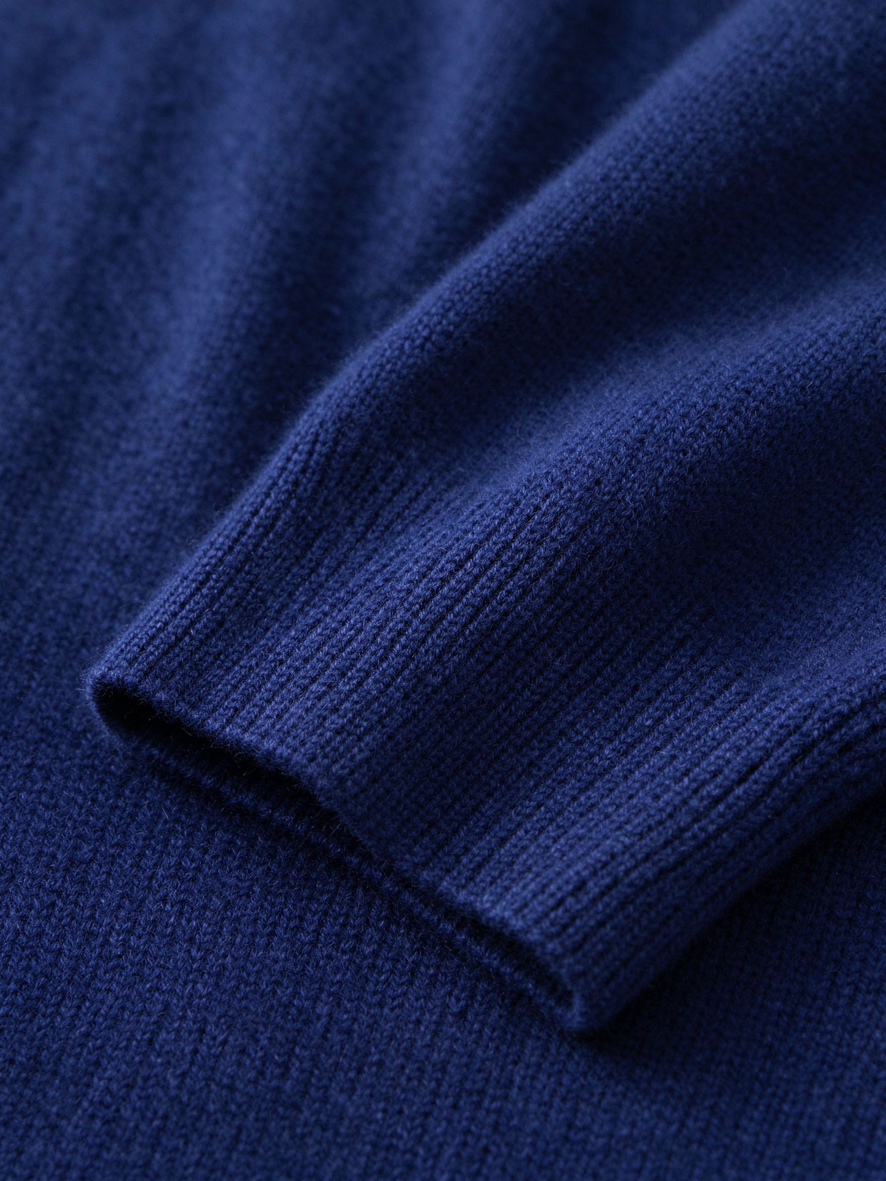 Close-up of fine knit fabric and ribbed cuff