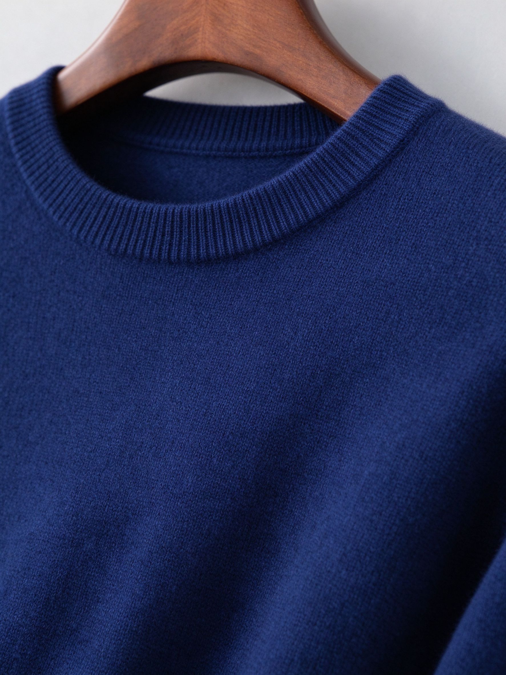 Close-up of ribbed crew neck and fine knit