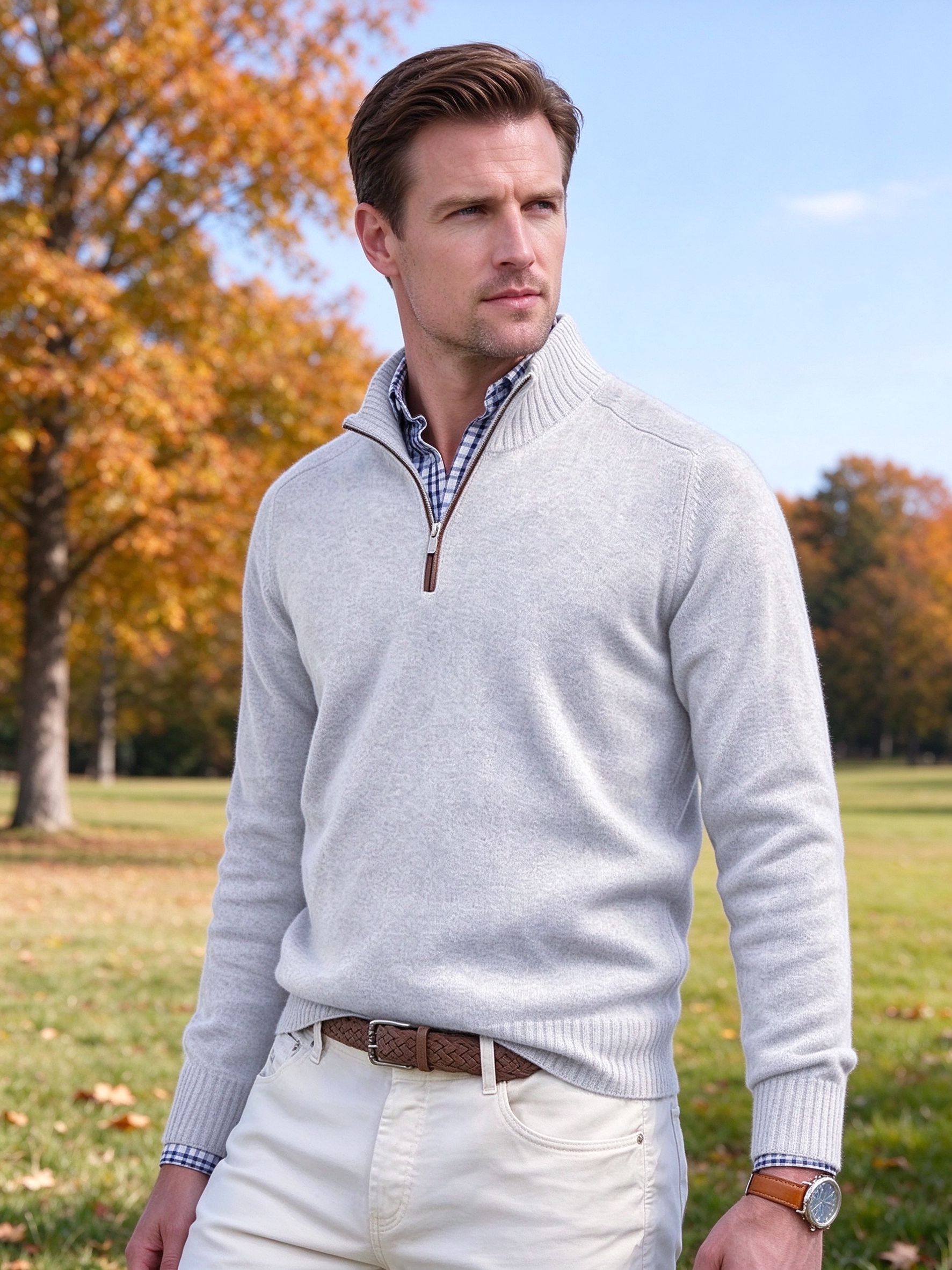 man in light grey quarter-zip knit sweater over check shirt
