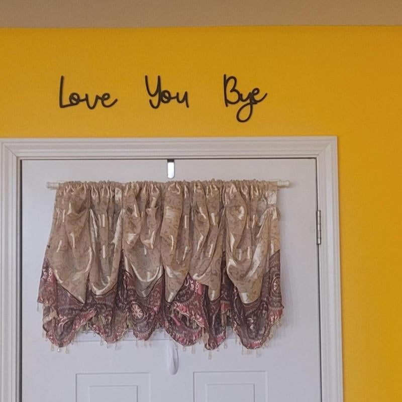 Love You Bye Sign Above Door