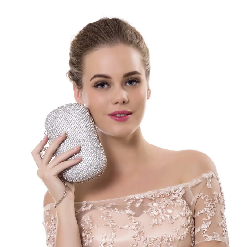 Model holding a YNSSK Rhinestone Ring Evening Bag