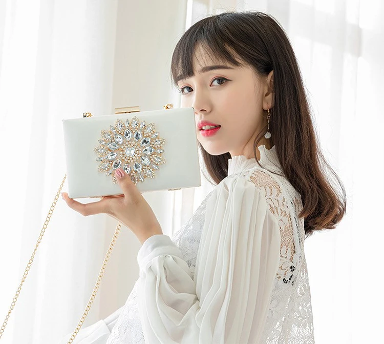 Model holding a YNSSK Luxury Rhinestone Evening Bag